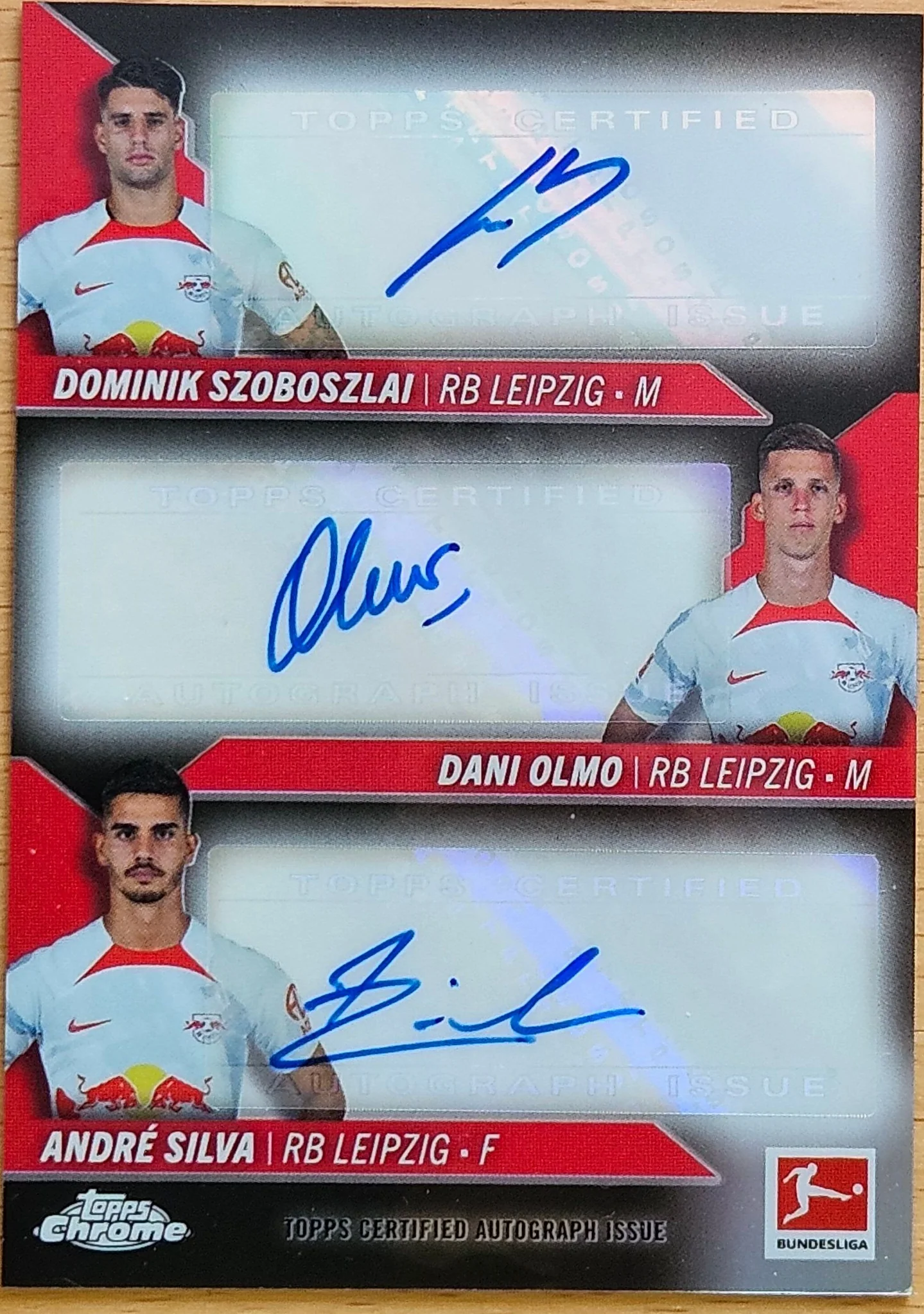 front of Dominik Szoboszlai's Topps Chrome Bundesliga card at high resolution