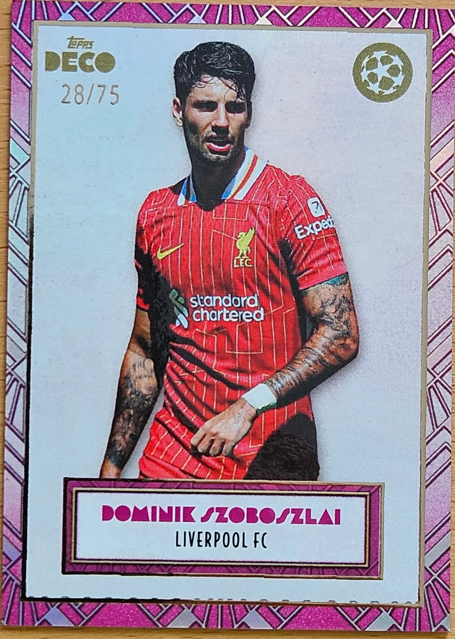 front of Dominik Szoboszlai's Topps Deco UEFA Champions League card at high resolution