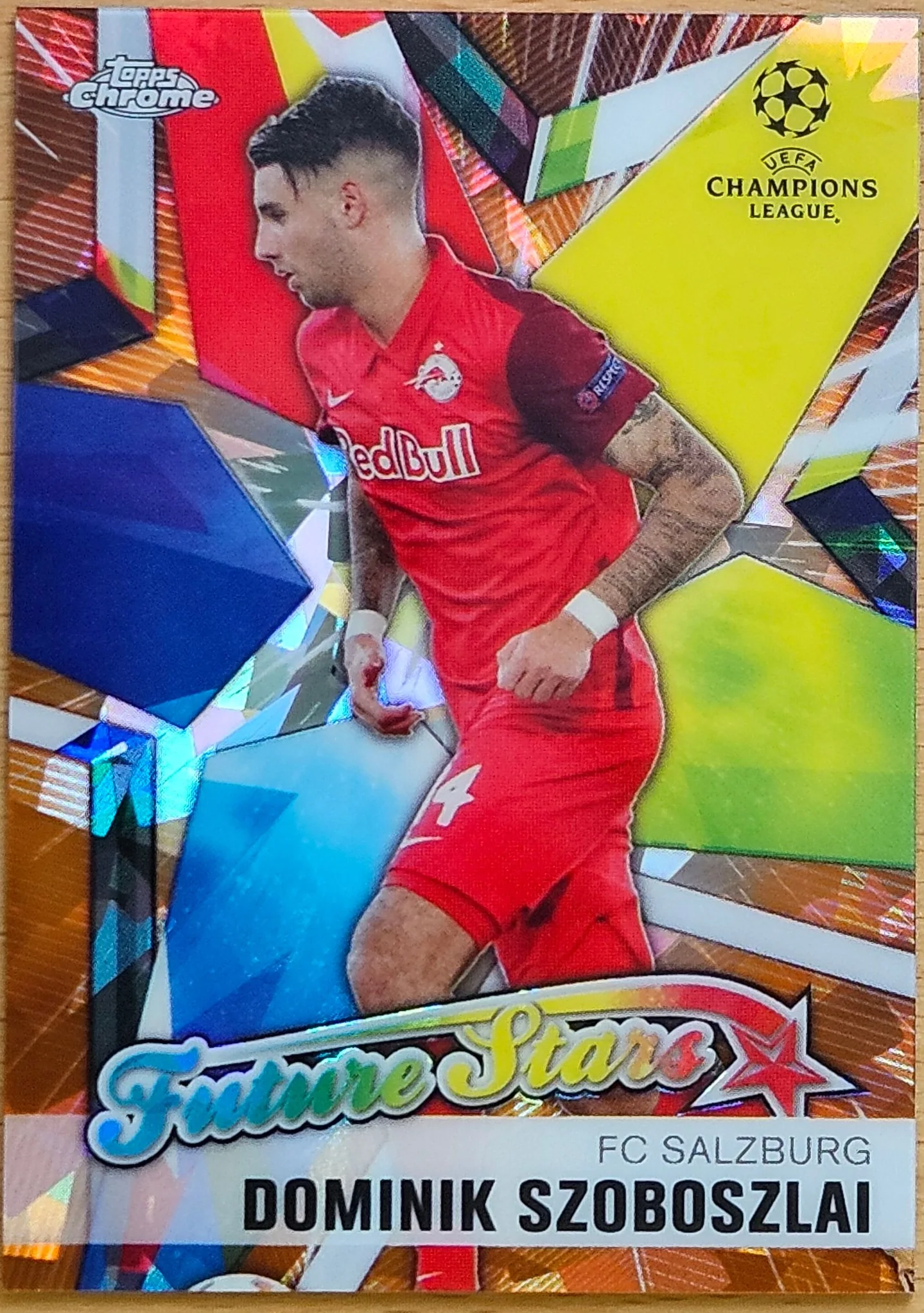 front of Dominik Szoboszlai's Topps Chrome UEFA Champions League card at high resolution