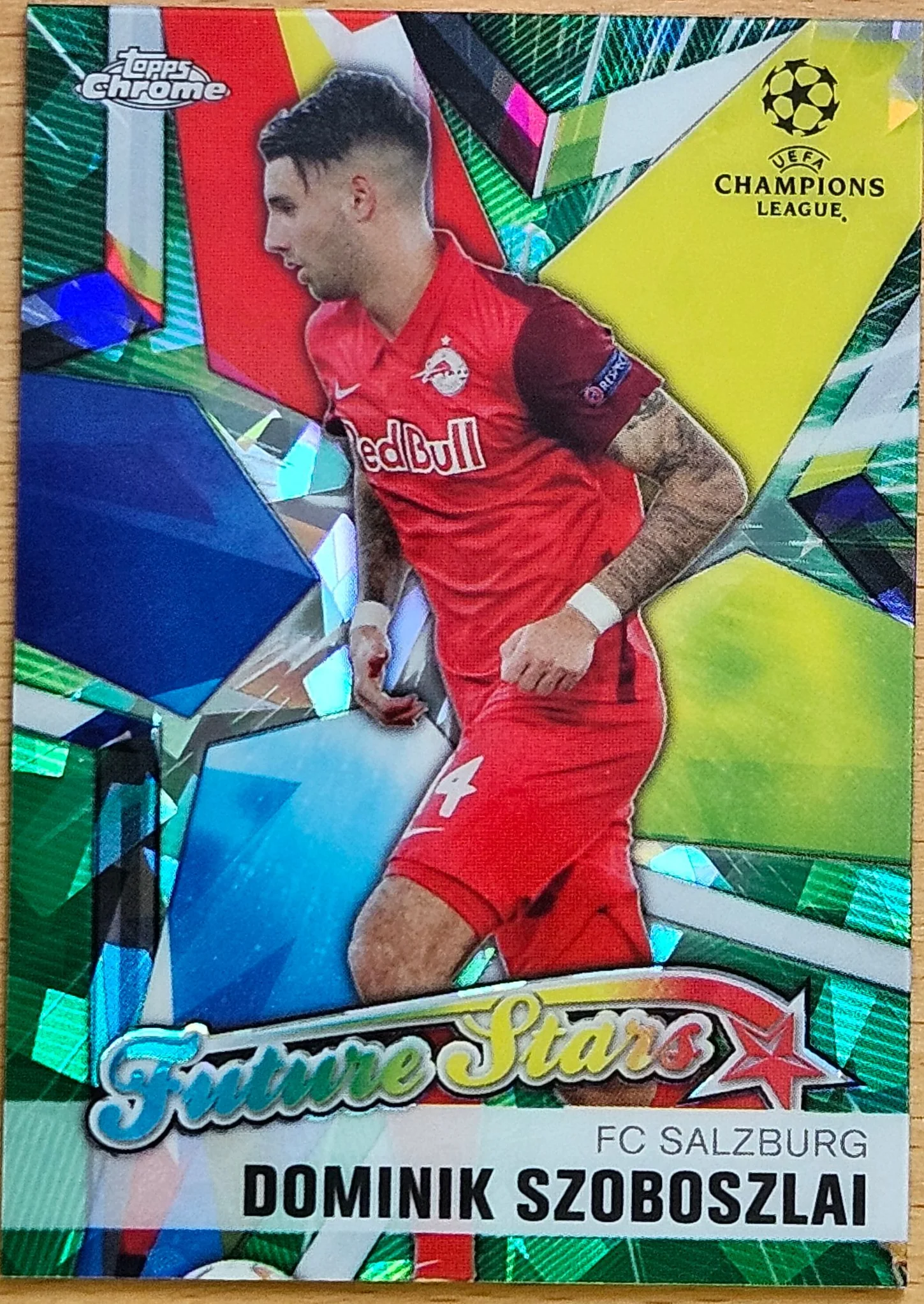 front of Dominik Szoboszlai's Topps Chrome UEFA Champions League card at high resolution