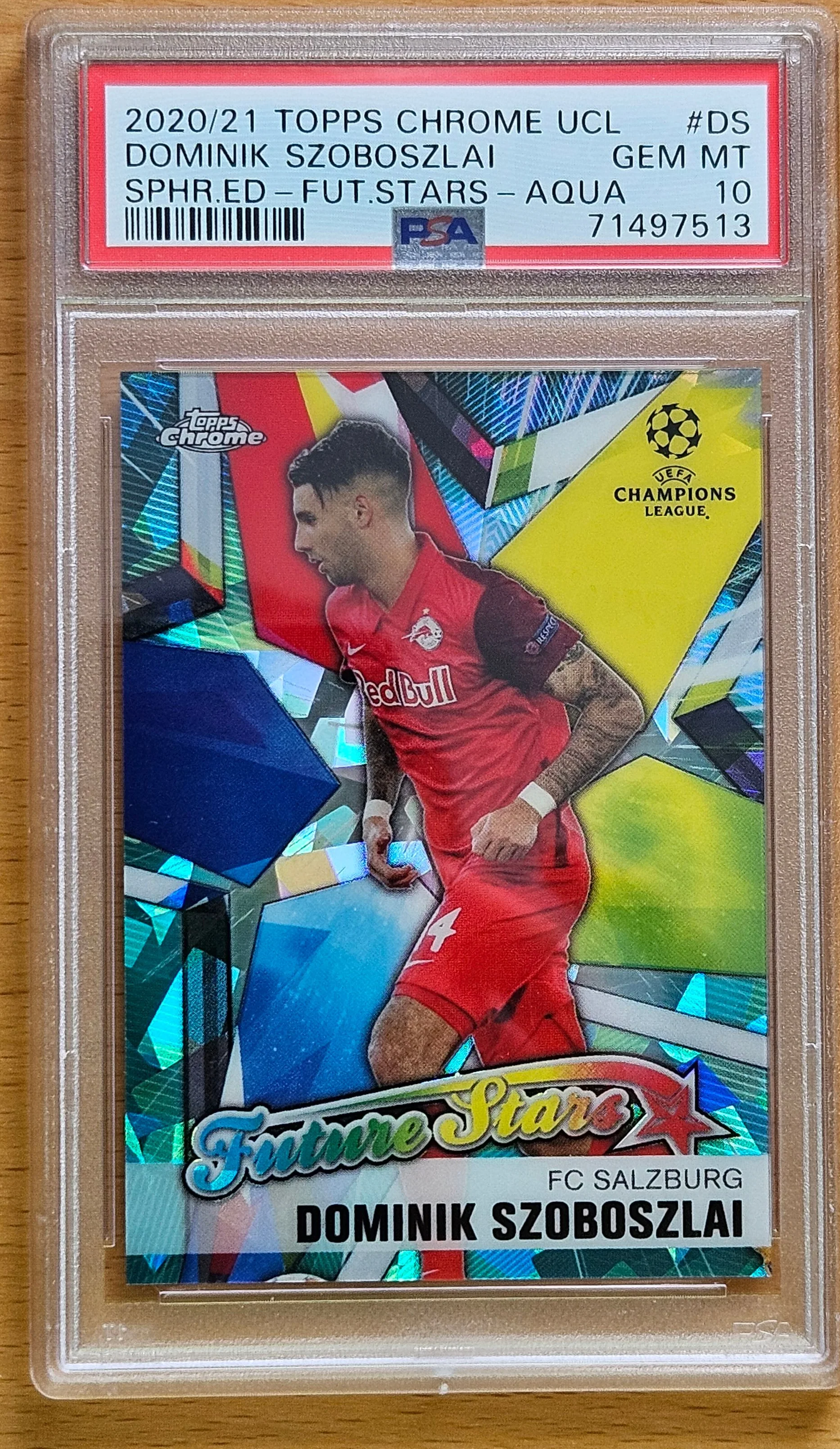 front of Dominik Szoboszlai's Topps Chrome UEFA Champions League card at high resolution